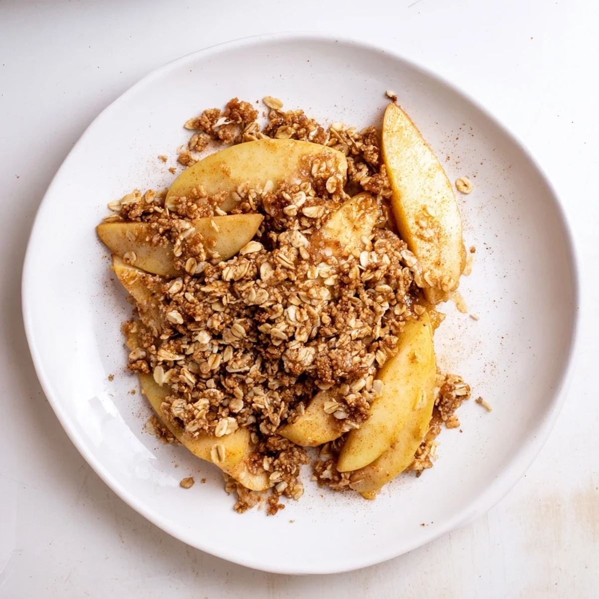 Warm Cinnamon Oat Apple Crisp bubbling hot after baking, with a golden oat topping.