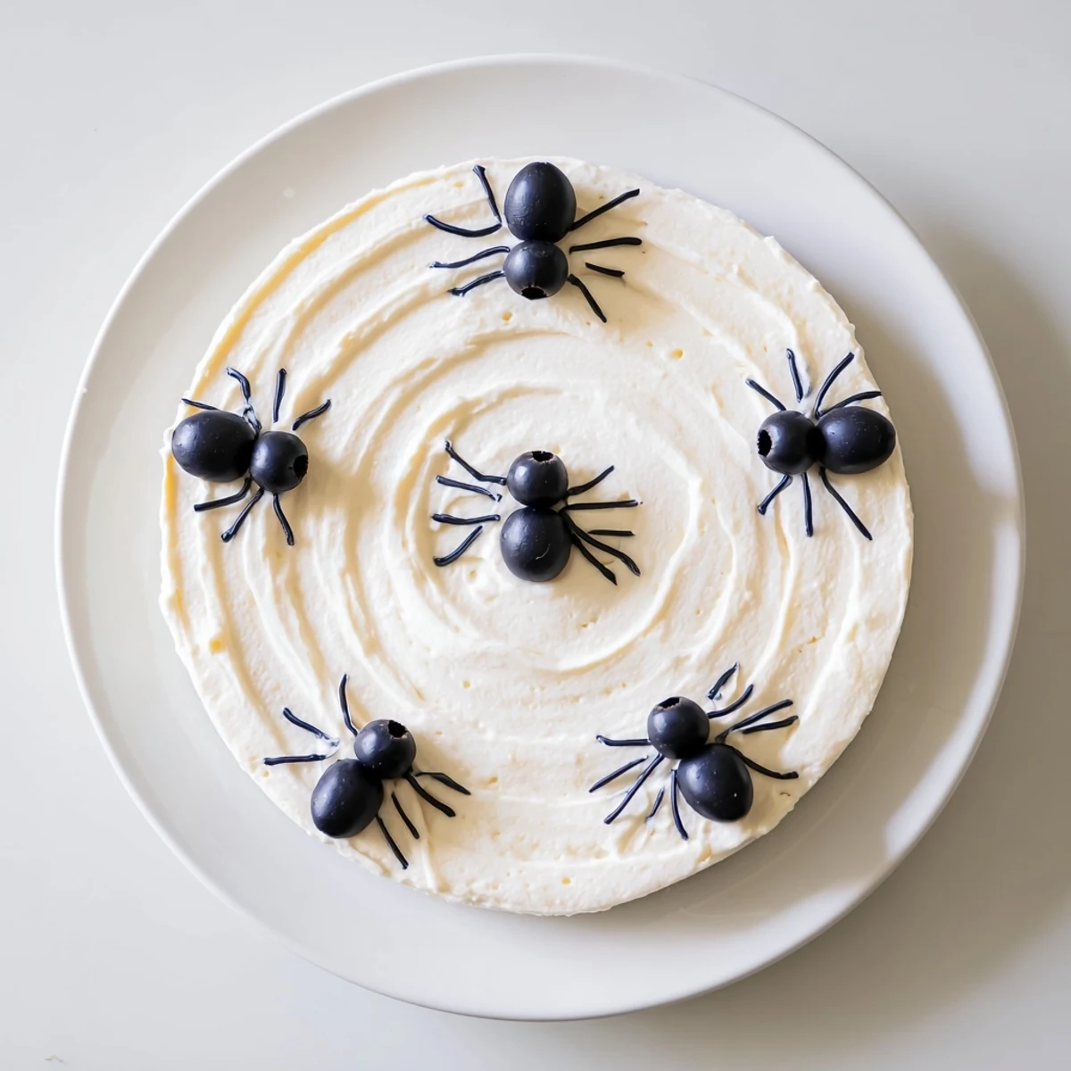 A delicious view of the festive Creepy Crawly Spiderweb Platter served with colorful vegetable dippers.