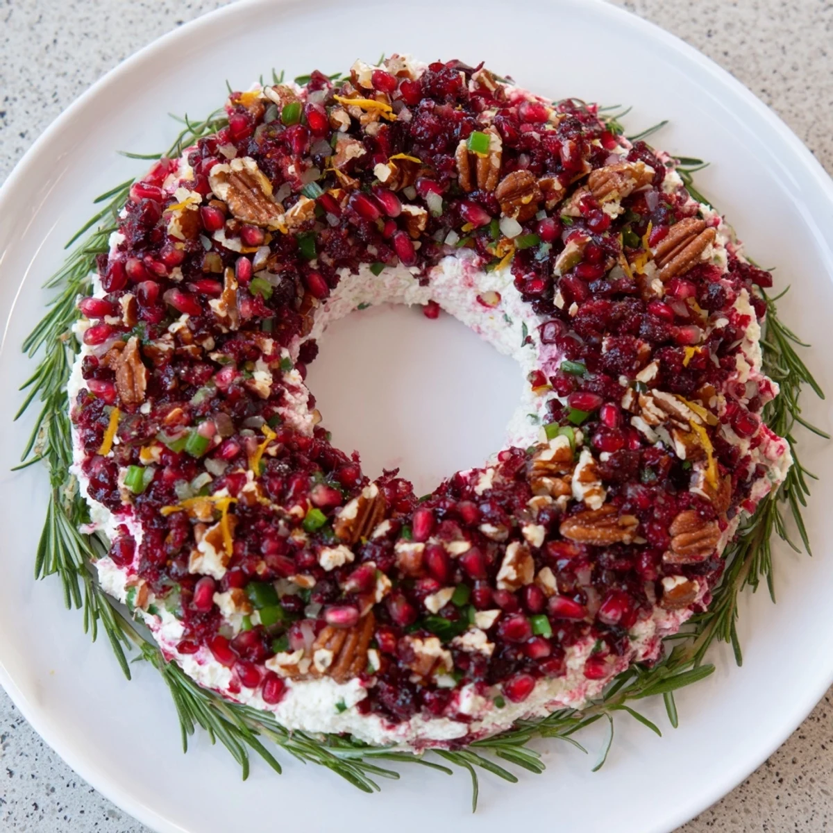 Vibrant Cranberry Feta Dip Wreath decorated with fresh rosemary, ready for holiday entertaining and dipping.