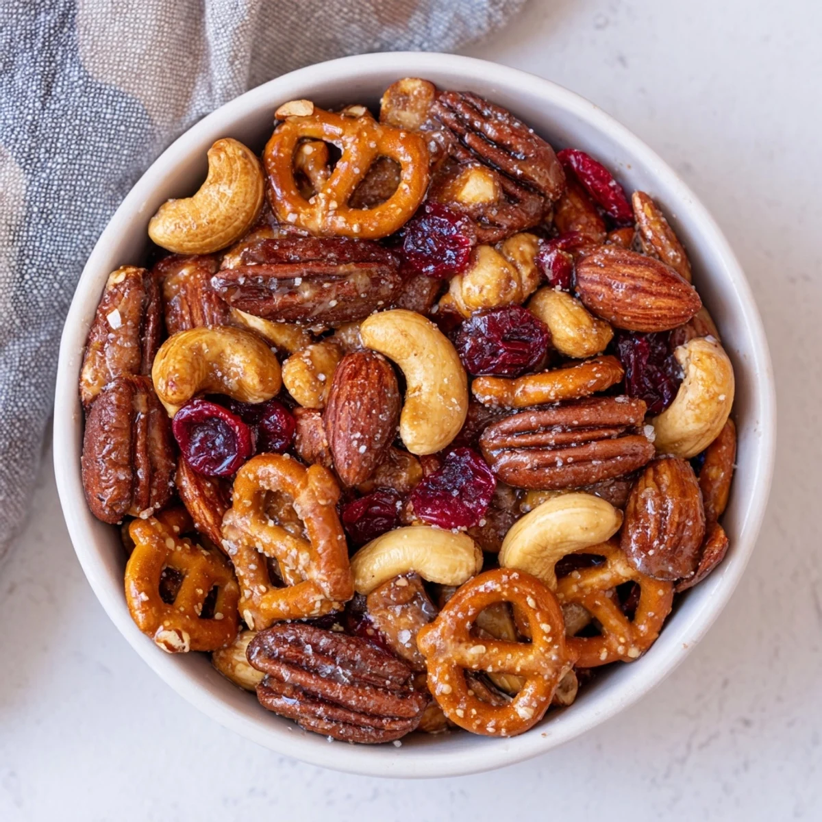 Delicious Sweet and Salty Holiday Nut Bowl, a tempting blend of roasted nuts, perfect for holiday gatherings.