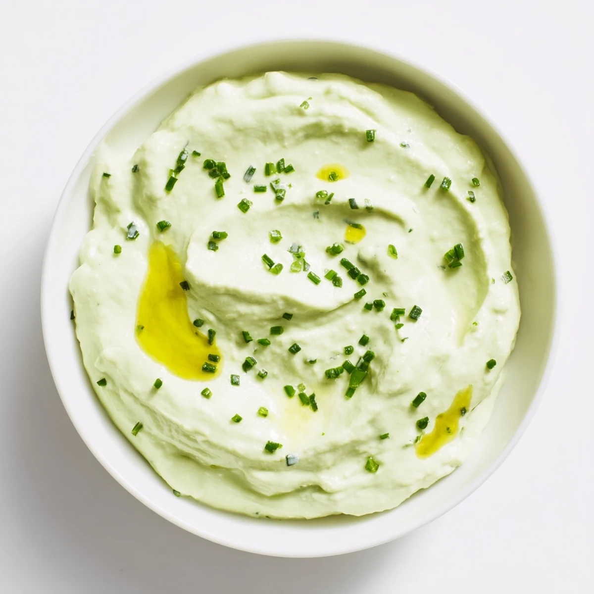 Creamy Avocado Cottage Cheese Dip, a vibrant green dip ready to scoop with crunchy veggies.