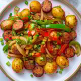 Sizzling Spicy Kielbasa and Potato Skillet: a vibrant one-pan meal with smoky flavors and perfectly cooked vegetables.