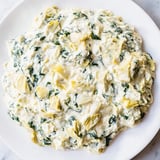 Close-up of creamy spinach artichoke dip, baked until golden brown and ready to serve.