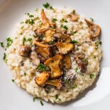 A close-up view of Italian mushroom risotto, rich and inviting, ready to be served.