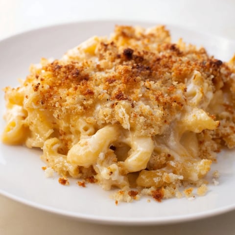 Golden, bubbly Old-Fashioned Baked Mac & Cheese with a crunchy topping ready to scoop.