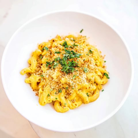 Golden, bubbly Curry Comfort Mac and Cheese, a fusion of creamy cheese sauce and aromatic spices.