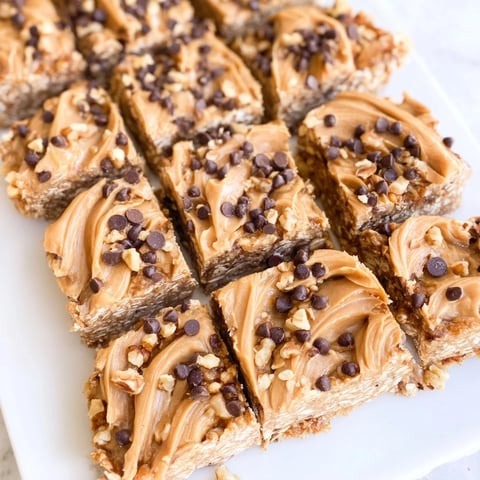 Delicious Peanut Butter Banana Oat Bars, a no-bake treat with visible oats and chocolate chips.