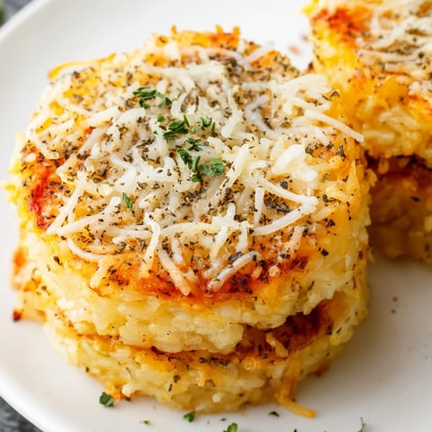 Golden, crispy Crispy Rice Cake Cheese Stacks fresh from the oven on a baking sheet. 
