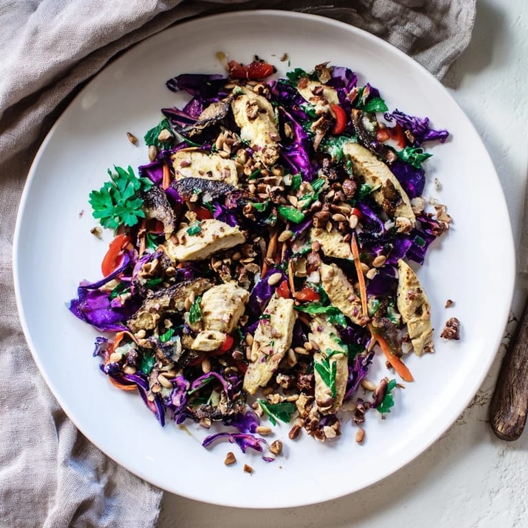 Fresh carrot ribbons and chicken are tossed in a flavorful dressing for this vibrant Chicken Slaw salad.