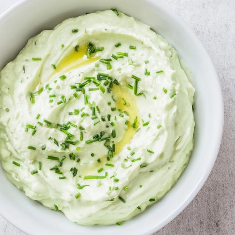 Freshly made Avocado Cottage Cheese Dip, blended with herbs, perfect for a healthy snack or appetizer.