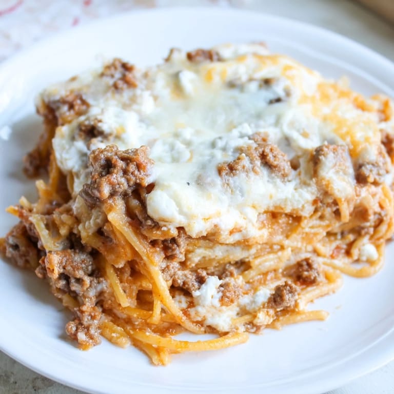 Generous serving of Million Dollar Spaghetti, boasting creamy Alfredo and a perfect balance of textures.