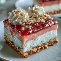 Freshly baked Guava Cloud Pie with a golden macadamia nut crust and pillowy whipped cream topping.